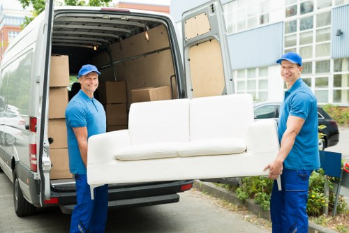 Professional removals and storage services in Plaistow with packed boxes and moving van