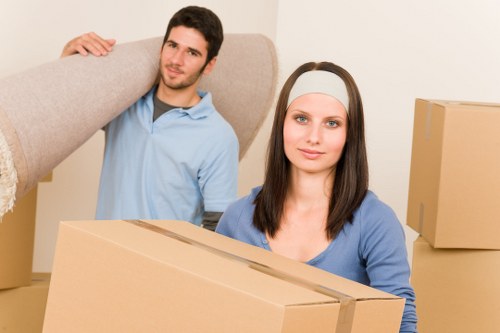 Packed moving boxes and furniture prepared for removal in Plaistow